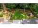 Aerial view of the home's backyard featuring lush greenery, a patio and storage shed at 1718 Cahoon Sw St, Atlanta, GA 30310