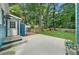 Large, private backyard with mature trees and a concrete patio, perfect for outdoor entertaining at 1718 Cahoon Sw St, Atlanta, GA 30310