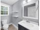 Bathroom with tiled floors, new sink and modern fixtures at 1718 Cahoon Sw St, Atlanta, GA 30310