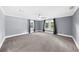 Spacious bedroom featuring neutral walls, carpet, and a ceiling fan at 1718 Cahoon Sw St, Atlanta, GA 30310