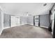Spacious bedroom with fan, window, and gray carpet at 1718 Cahoon Sw St, Atlanta, GA 30310
