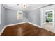 Light-filled bedroom features wood floors, white trim, and neutral paint, creating a serene and inviting space at 1718 Cahoon Sw St, Atlanta, GA 30310