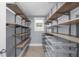 Large walk-in closet with custom shelving and organization at 1718 Cahoon Sw St, Atlanta, GA 30310