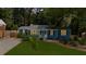 Charming home featuring a well-manicured lawn, fresh exterior paint and complementary landscaping at 1718 Cahoon Sw St, Atlanta, GA 30310