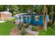 Charming home featuring a well-manicured lawn, fresh exterior paint and complementary landscaping at 1718 Cahoon Sw St, Atlanta, GA 30310