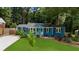 Charming blue home with black shutters and a neatly landscaped front yard at 1718 Cahoon Sw St, Atlanta, GA 30310