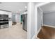 Bright kitchen with stainless steel appliances and white cabinets at 1718 Cahoon Sw St, Atlanta, GA 30310
