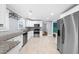 Modern kitchen with white cabinets, stainless appliances, and granite countertops, creating a sleek and functional design at 1718 Cahoon Sw St, Atlanta, GA 30310