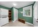 Well-lit laundry room complete with washer, dryer, and cabinet space at 1718 Cahoon Sw St, Atlanta, GA 30310