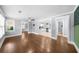 Open-concept living room featuring hardwood floors, neutral walls, and modern lighting at 1718 Cahoon Sw St, Atlanta, GA 30310