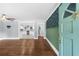 Inviting living room with hardwood floors and a glimpse into the modern kitchen at 1718 Cahoon Sw St, Atlanta, GA 30310