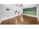 Open-concept living area with hardwood floors, neutral walls, and kitchen view, perfect for entertaining and relaxed living at 1718 Cahoon Sw St, Atlanta, GA 30310