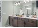 Bathroom features dual sinks, modern fixtures, and a large mirror for a luxurious experience at 48 Calla Dr, Douglasville, GA 30134