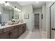Beautiful bathroom featuring dual vanity, lots of lighting and patterned tiling at 48 Calla Dr, Douglasville, GA 30134