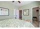 Comfortable bedroom featuring neutral paint, bed with green accents, and walk-in closet at 48 Calla Dr, Douglasville, GA 30134