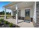 Inviting front porch featuring seating and a stylish front door, creating a welcoming entrance at 48 Calla Dr, Douglasville, GA 30134