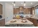 Well-lit kitchen featuring a central island, modern cabinets, and stainless steel microwave at 48 Calla Dr, Douglasville, GA 30134