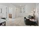 Comfortable loft area featuring a chair, desk, and view into the bathroom at 48 Calla Dr, Douglasville, GA 30134