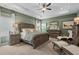 Elegant main bedroom boasts a tray ceiling and warm green walls, creating a serene retreat at 48 Calla Dr, Douglasville, GA 30134