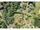 Aerial view of a neighborhood, featuring a home with lush green lawn and pool at 207 Breckenridge Ct, Canton, GA 30115