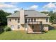 Expansive backyard showcasing the home's back elevation and an upper level deck at 207 Breckenridge Ct, Canton, GA 30115