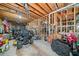 Unfinished basement with exposed beams, a ride on lawnmower and various tools at 207 Breckenridge Ct, Canton, GA 30115