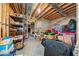 Unfinished basement with exposed beams, boxes, storage containers, and suitcases at 207 Breckenridge Ct, Canton, GA 30115