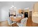 Elegant dining area showcasing hardwood floors, and a seamless flow to the modern kitchen at 207 Breckenridge Ct, Canton, GA 30115