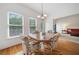 Bright dining space with hardwood floors, natural light, and easy access to the living area at 207 Breckenridge Ct, Canton, GA 30115