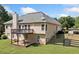 A two-story home featuring a spacious deck and backyard with fenced-in lawn at 207 Breckenridge Ct, Canton, GA 30115