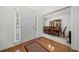 Welcoming foyer with gleaming hardwood floors leads to the dining room with elegant chandelier at 207 Breckenridge Ct, Canton, GA 30115
