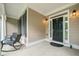 Inviting front porch with seating, perfect for enjoying the outdoors, and stylish front door at 207 Breckenridge Ct, Canton, GA 30115