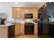 Modern kitchen featuring stainless steel appliances, light-colored cabinets, and ample counter space at 207 Breckenridge Ct, Canton, GA 30115