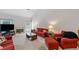 Bright living room featuring a cozy fireplace, plush seating, and ample natural light at 207 Breckenridge Ct, Canton, GA 30115