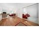 Spacious open living room with high ceilings, gleaming hardwood floors, and comfortable seating arrangement at 207 Breckenridge Ct, Canton, GA 30115