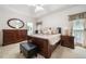Comfortable main bedroom with a king bed, dresser, and bedside tables with elegant decor at 207 Breckenridge Ct, Canton, GA 30115