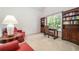 Cozy office space with built-in bookshelves, a comfortable seating area, and abundant natural light at 207 Breckenridge Ct, Canton, GA 30115