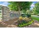 Stone monument sign for Breckenridge community with colorful flowerbed and landscaping at 207 Breckenridge Ct, Canton, GA 30115