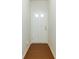 Bright hallway with a white door, light walls and a brown floor at 3016 Creekside Overlook Way, Austell, GA 30168