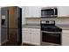 Kitchen showcases a stainless steel refrigerator and range at 3016 Creekside Overlook Way, Austell, GA 30168