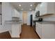 Kitchen with white cabinets, stainless steel appliances, and granite countertops at 3016 Creekside Overlook Way, Austell, GA 30168