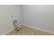This laundry room has vinyl floors and a dryer connection at 3016 Creekside Overlook Way, Austell, GA 30168
