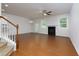 Spacious living room showcasing hardwood floors, a fireplace, and natural light at 3016 Creekside Overlook Way, Austell, GA 30168