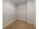 Walk-in closet with ample storage and metal racks for organization at 3016 Creekside Overlook Way, Austell, GA 30168