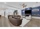 Living room with open floor plan, large sectional, and modern fireplace with a television at 2497 Wawona Dr, Brookhaven, GA 30319