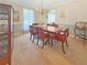 Traditional dining room featuring a wooden table, chandelier, and ample natural light at 2251 Stag Run Run, Suwanee, GA 30024