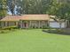 Charming single-story home featuring a well-manicured front lawn and an attached two car garage at 2251 Stag Run Run, Suwanee, GA 30024