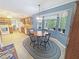 Eat-in kitchen boasts natural light, a cozy breakfast nook, and wood cabinets at 2251 Stag Run Run, Suwanee, GA 30024