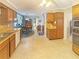 Spacious kitchen with a cozy breakfast nook and classic wooden cabinetry with views of the backyard at 2251 Stag Run Run, Suwanee, GA 30024