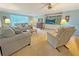 Cozy living room with comfortable seating, built-in shelves, and views of the outdoors at 2251 Stag Run Run, Suwanee, GA 30024